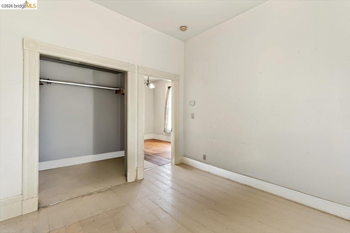 1013 Addison Street Berkeley, CA 94710 - Photo 19 of 57 Unfurnished bedroom featuring a closet and light wood finished floors