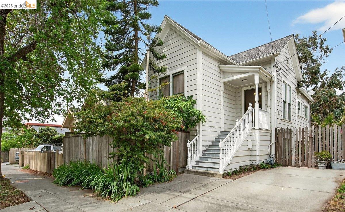 1013 Addison Street Berkeley, CA 94710 - Photo 3 of 57 View of front of home featuring stairs and a shingled roof