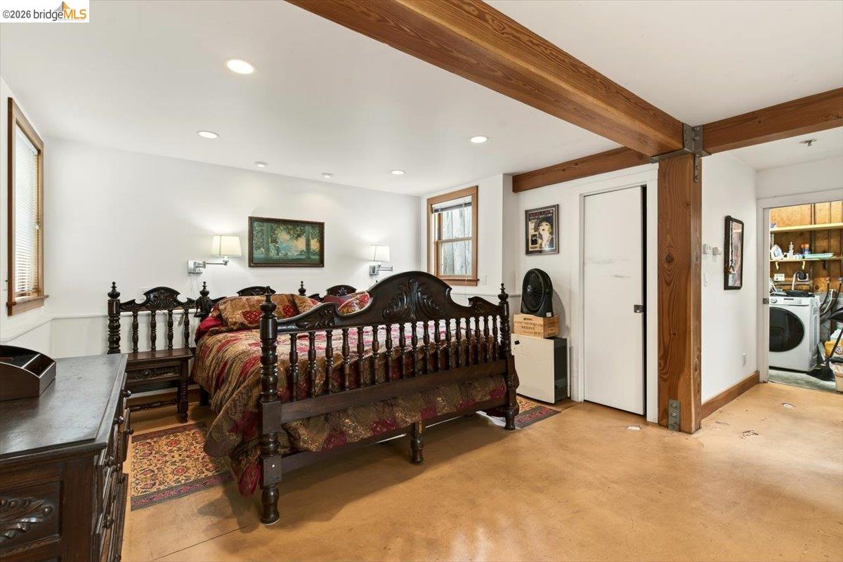 1013 Addison Street Berkeley, CA 94710 - Photo 31 of 57 Bedroom with washer / dryer, recessed lighting, finished concrete floors, and beamed ceiling