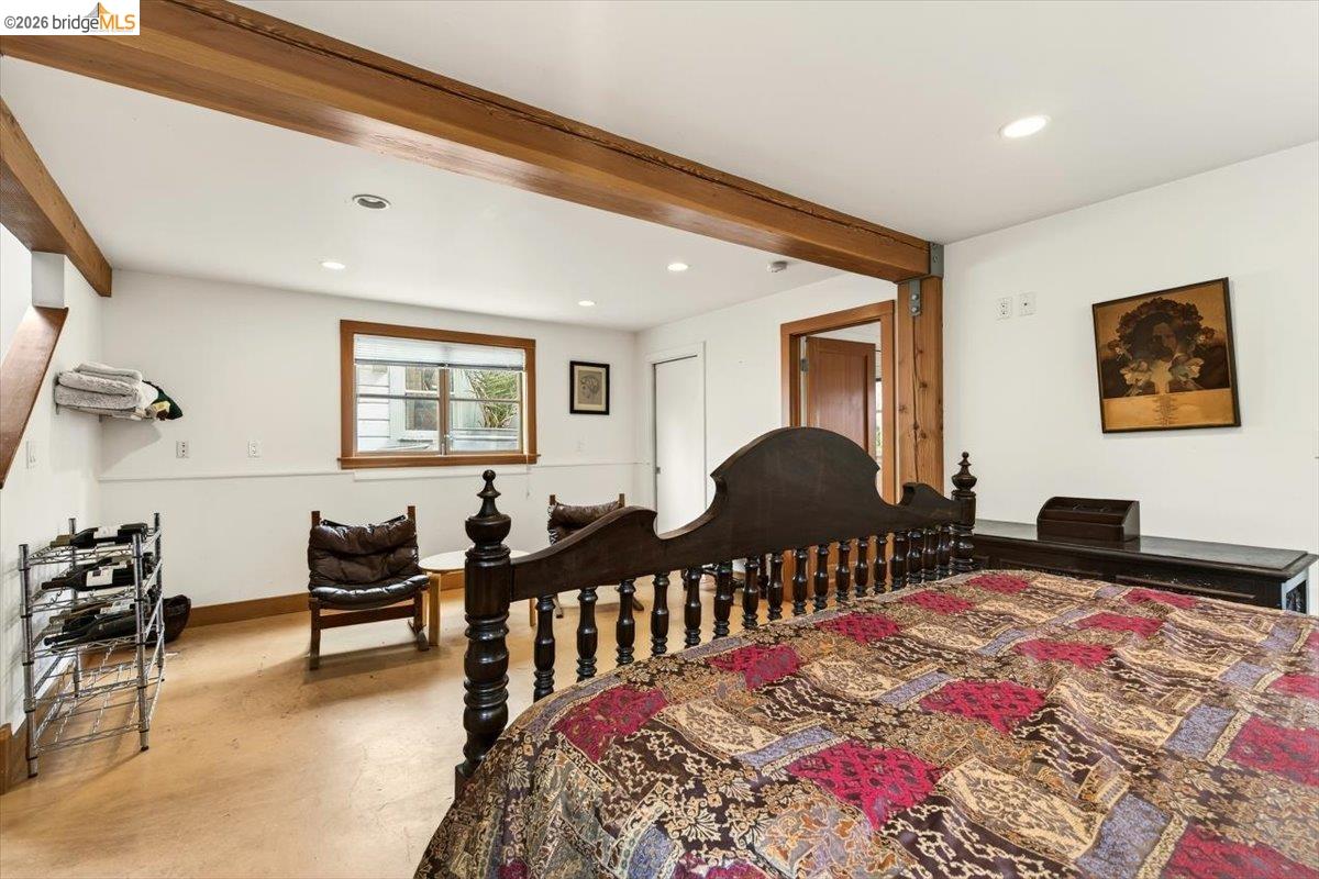1013 Addison Street Berkeley, CA 94710 - Photo 32 of 57 Bedroom featuring beamed ceiling, finished concrete floors, and recessed lighting