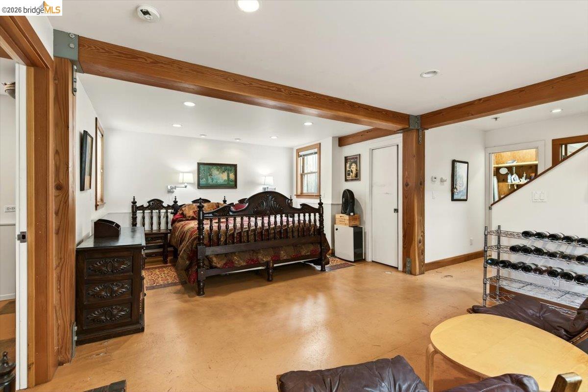 1013 Addison Street Berkeley, CA 94710 - Photo 37 of 57 Bedroom with recessed lighting, beam ceiling, and concrete flooring
