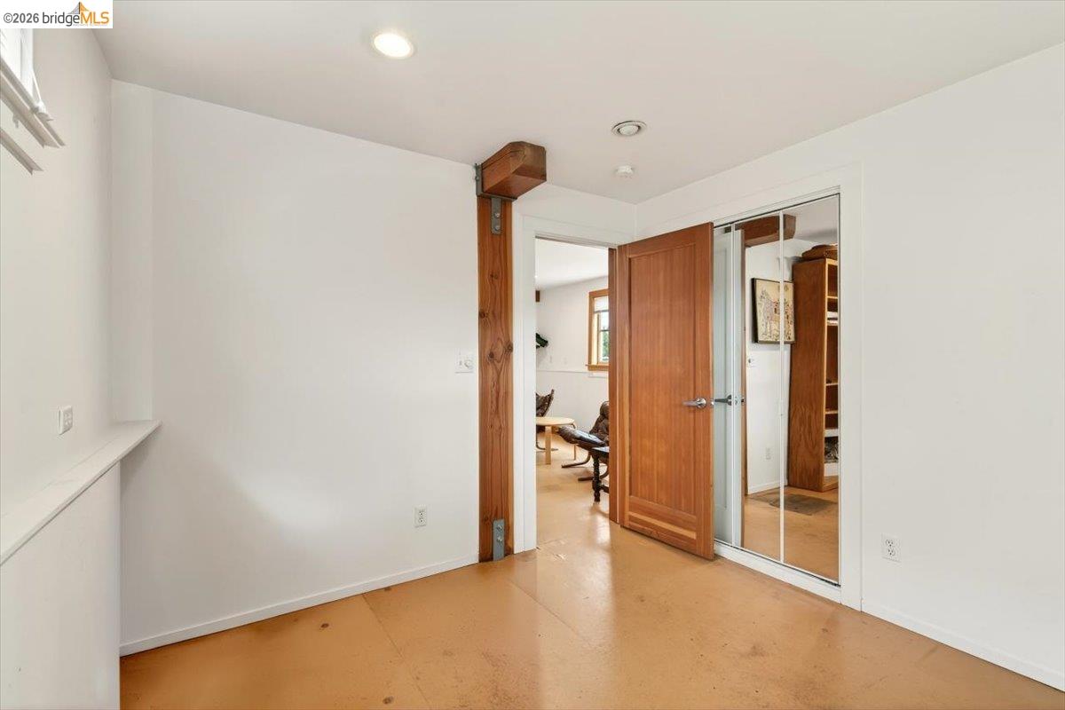 1013 Addison Street Berkeley, CA 94710 - Photo 40 of 57 Unfurnished bedroom featuring a closet, concrete flooring, and recessed lighting