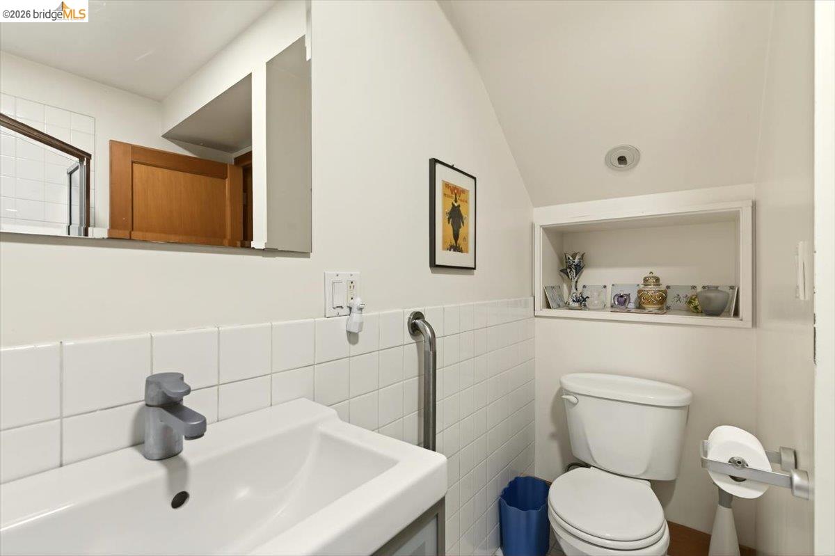 1013 Addison Street Berkeley, CA 94710 - Photo 45 of 57 Bathroom with toilet and tile walls