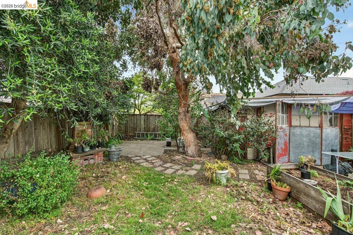1013 Addison Street Berkeley, CA 94710 - Photo 51 of 57 Fenced backyard featuring a patio and a vegetable garden