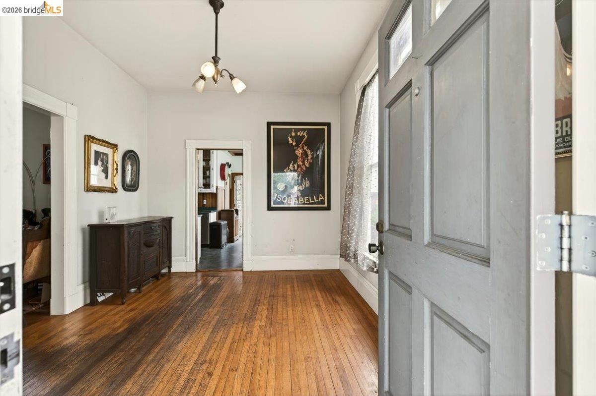 1013 Addison Street Berkeley, CA 94710 - Photo 8 of 57 Entrance foyer with dark wood finished floors and a chandelier