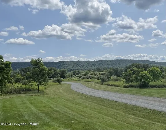 a view of a lake with a big yard