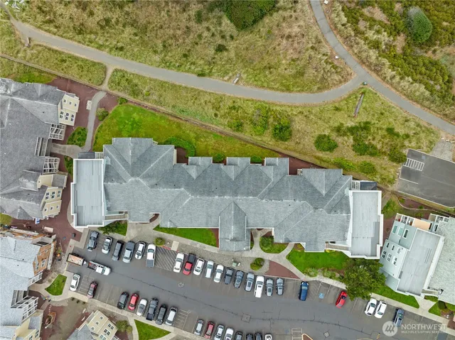 an aerial view of residential houses with outdoor space