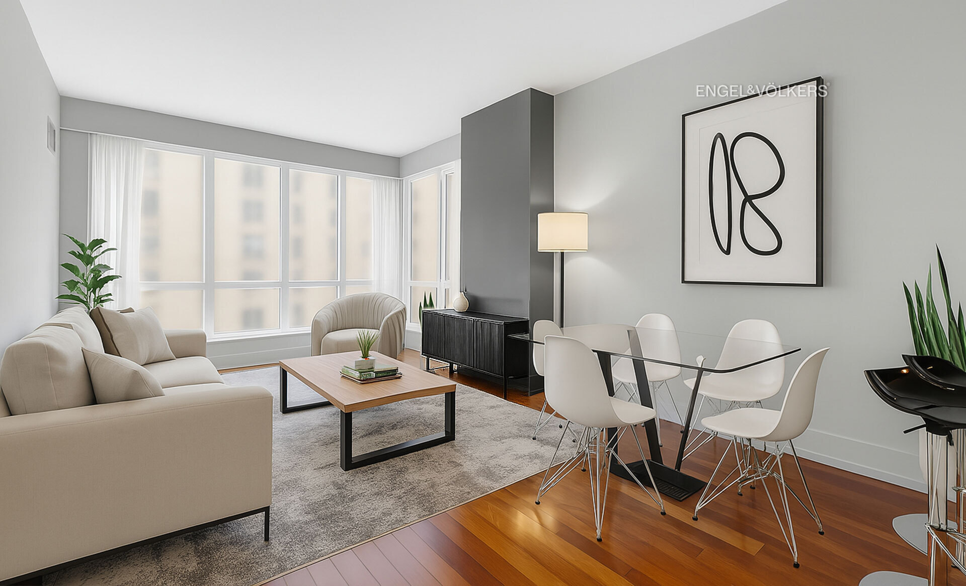 a living room with furniture and wooden floor