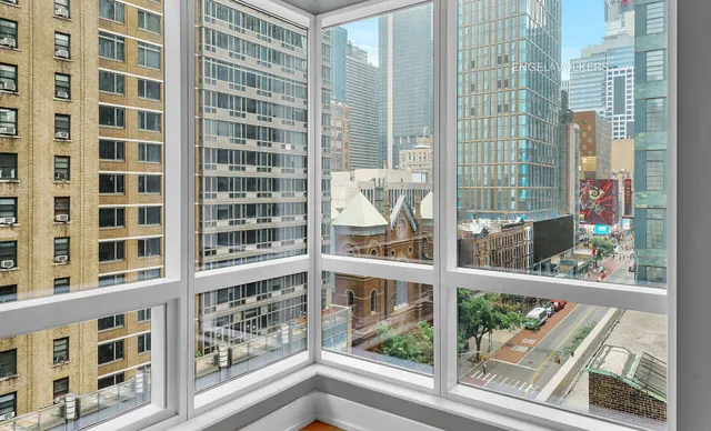 a bedroom with a bed and a lamp on table