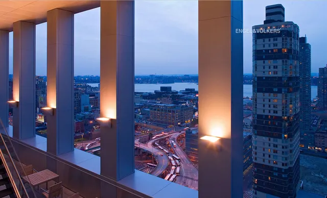 a room with pool table and windows