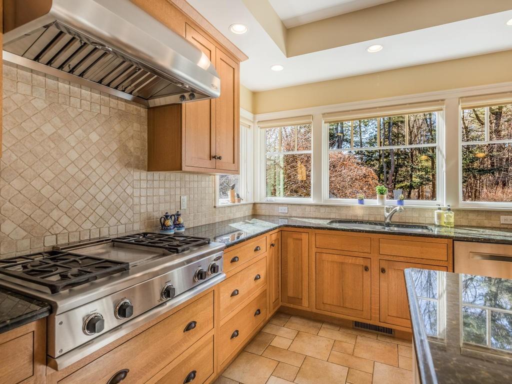 5 Saddle Club Road Lexington, MA 02420 - Photo 18 of 42 a kitchen with granite countertop a stove and a sink