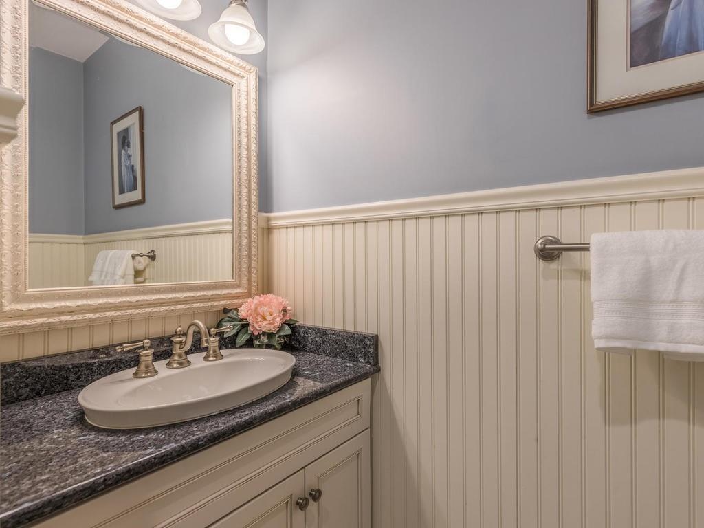 5 Saddle Club Road Lexington, MA 02420 - Photo 20 of 42 a bathroom with a granite countertop sink and a mirror