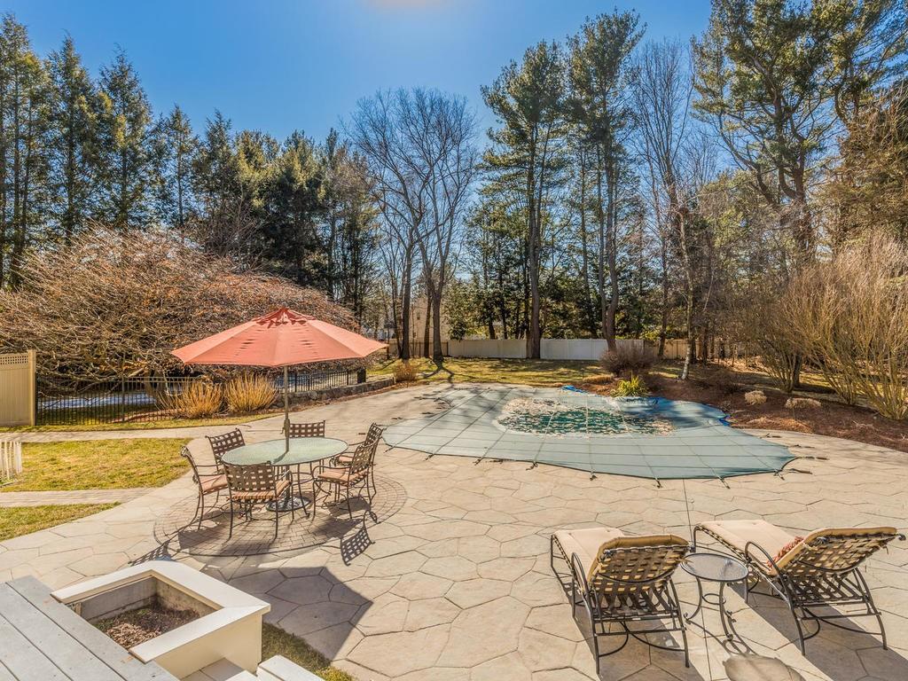 5 Saddle Club Road Lexington, MA 02420 - Photo 39 of 42 a view of a swimming pool with a patio