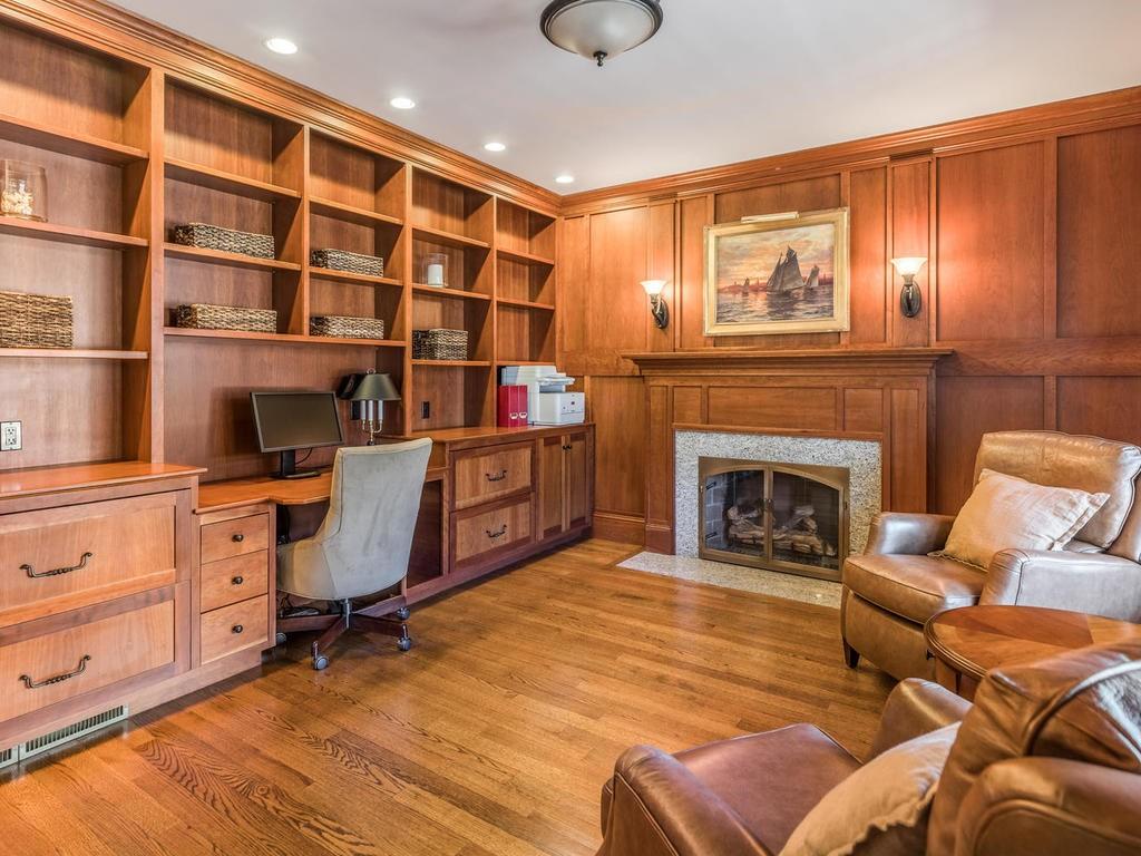 5 Saddle Club Road Lexington, MA 02420 - Photo 7 of 42 a living room with furniture cabinets and a fireplace