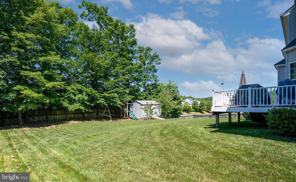 21 Gallery Road Stafford, VA 22554 - Photo 6 of 60 Flat yard with playground, fence, deck and shed