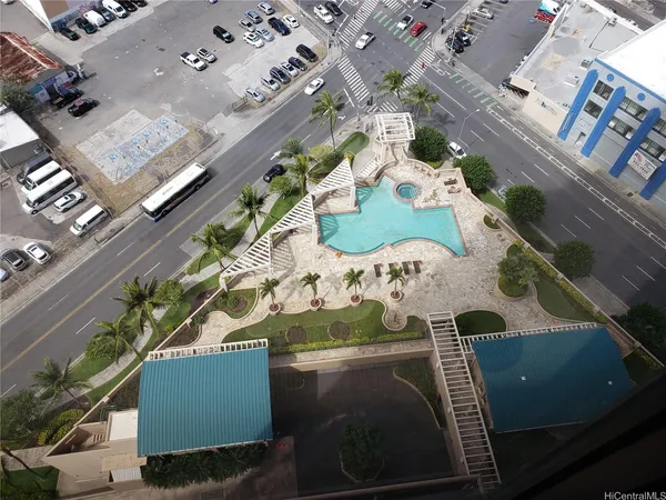 a view of an outdoor dining space with a table and chairs