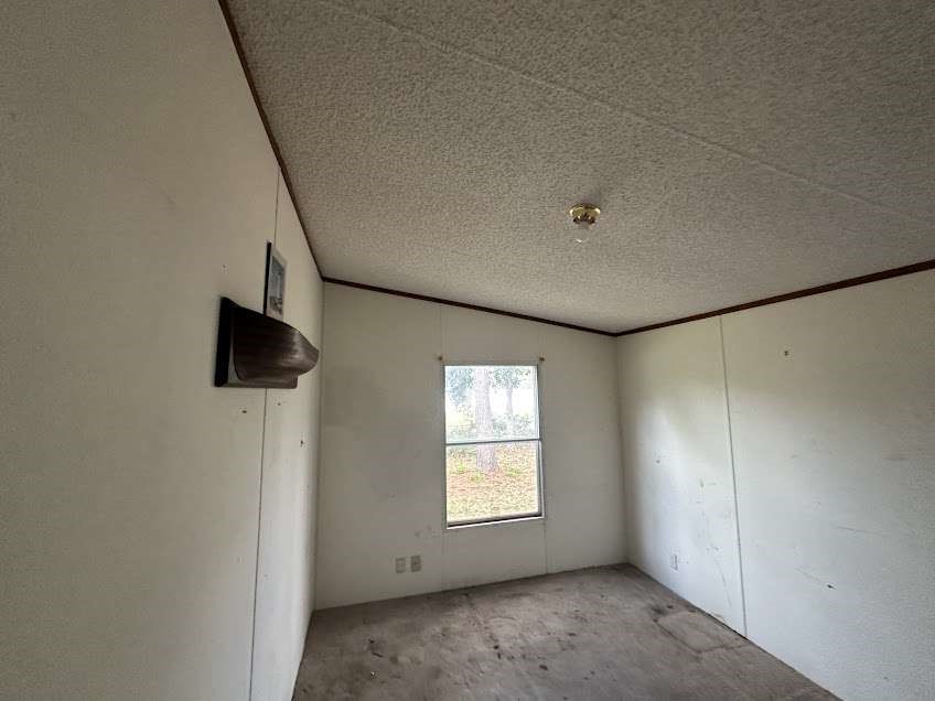 9443 1st Street Lumberton, TX 77657 - Photo 5 of 7 a view of empty room with windows
