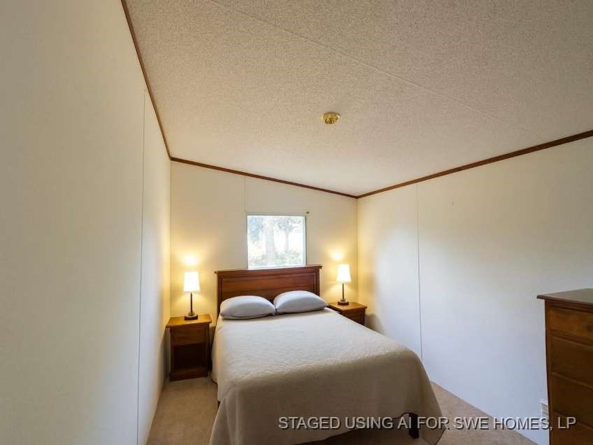 9443 1st Street Lumberton, TX 77657 - Photo 6 of 7 a bedroom with a bed and a window