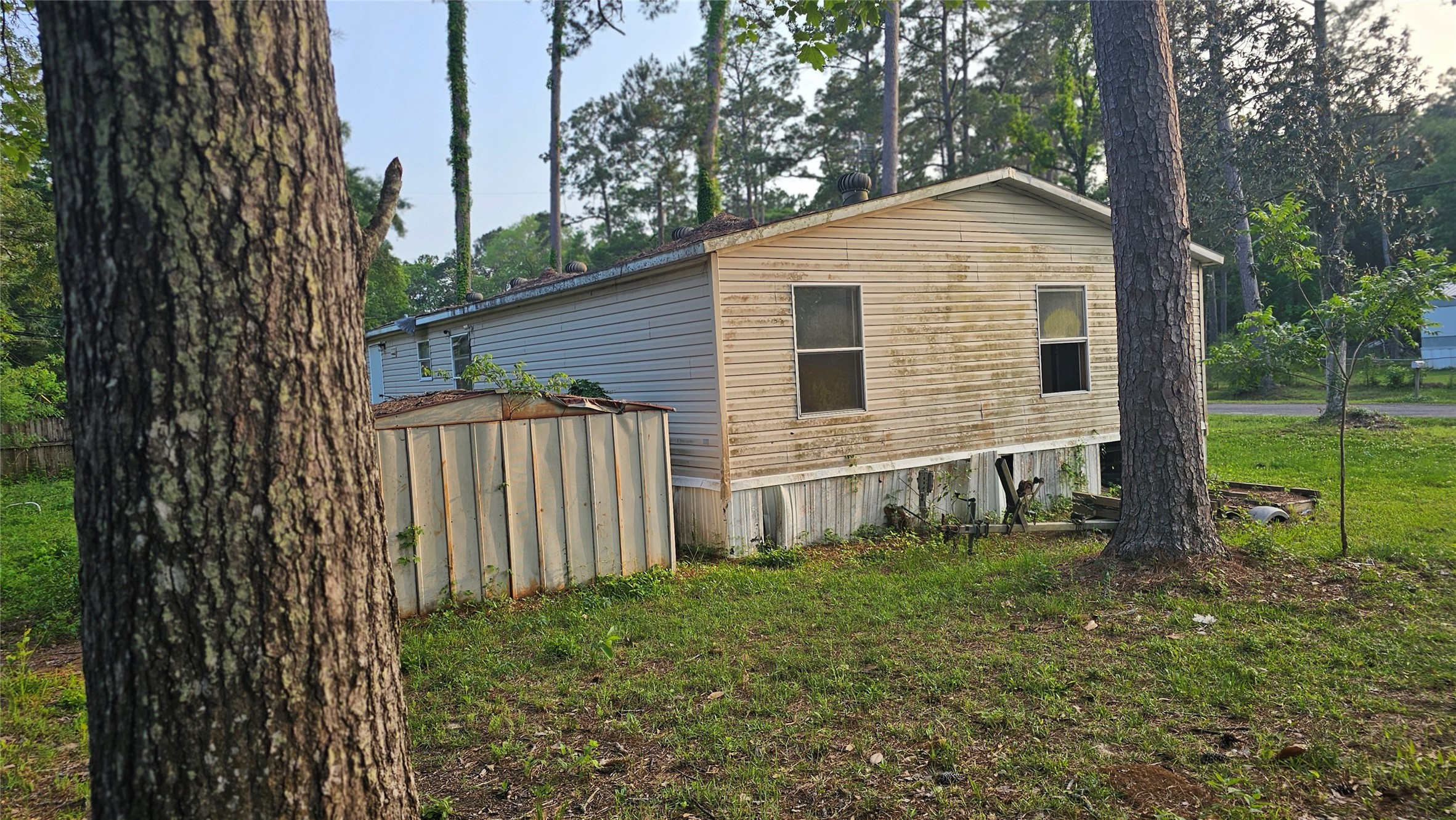 9443 1st Street Lumberton, TX 77657 - Photo 7 of 7 a view of backyard of house with wooden fence