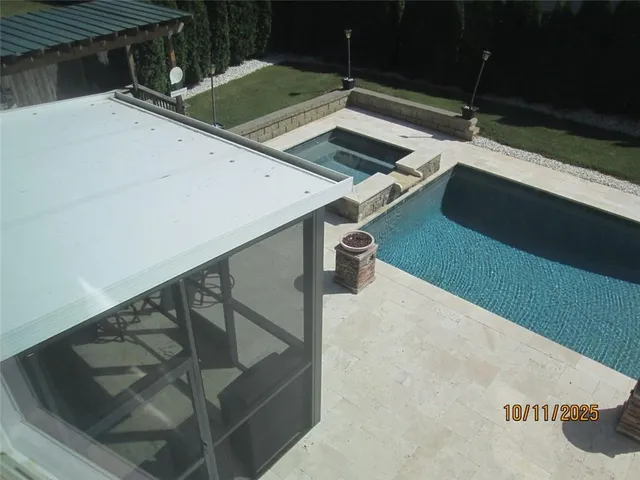 a bathroom with a glass door shower and a sink