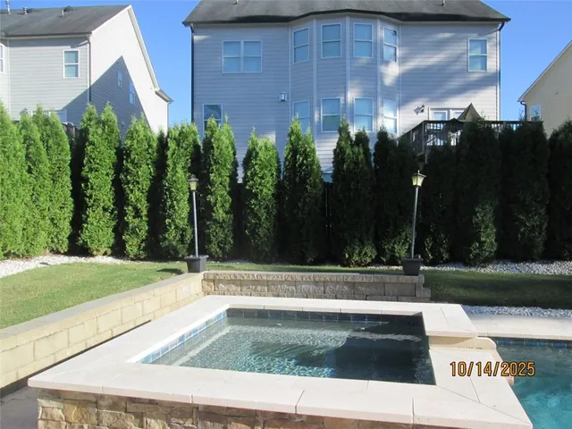 a view of an empty room and a window