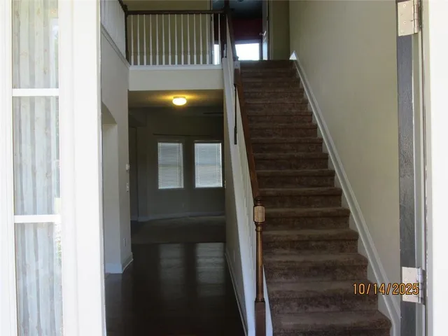 a front view of a house with parking space