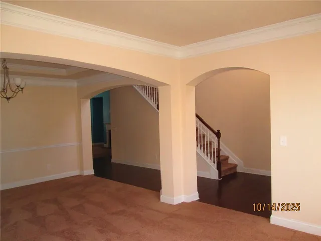 a view of a hallway with staircase