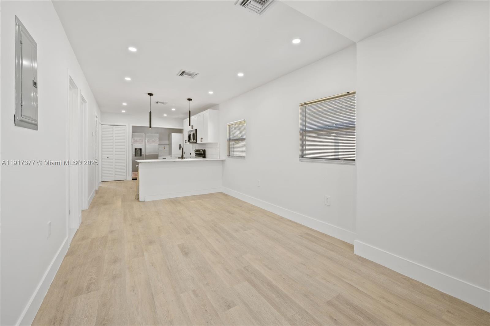 1844 Northwest 67th Street Miami, FL 33147 - Photo 11 of 27 a view of kitchen with wooden floor