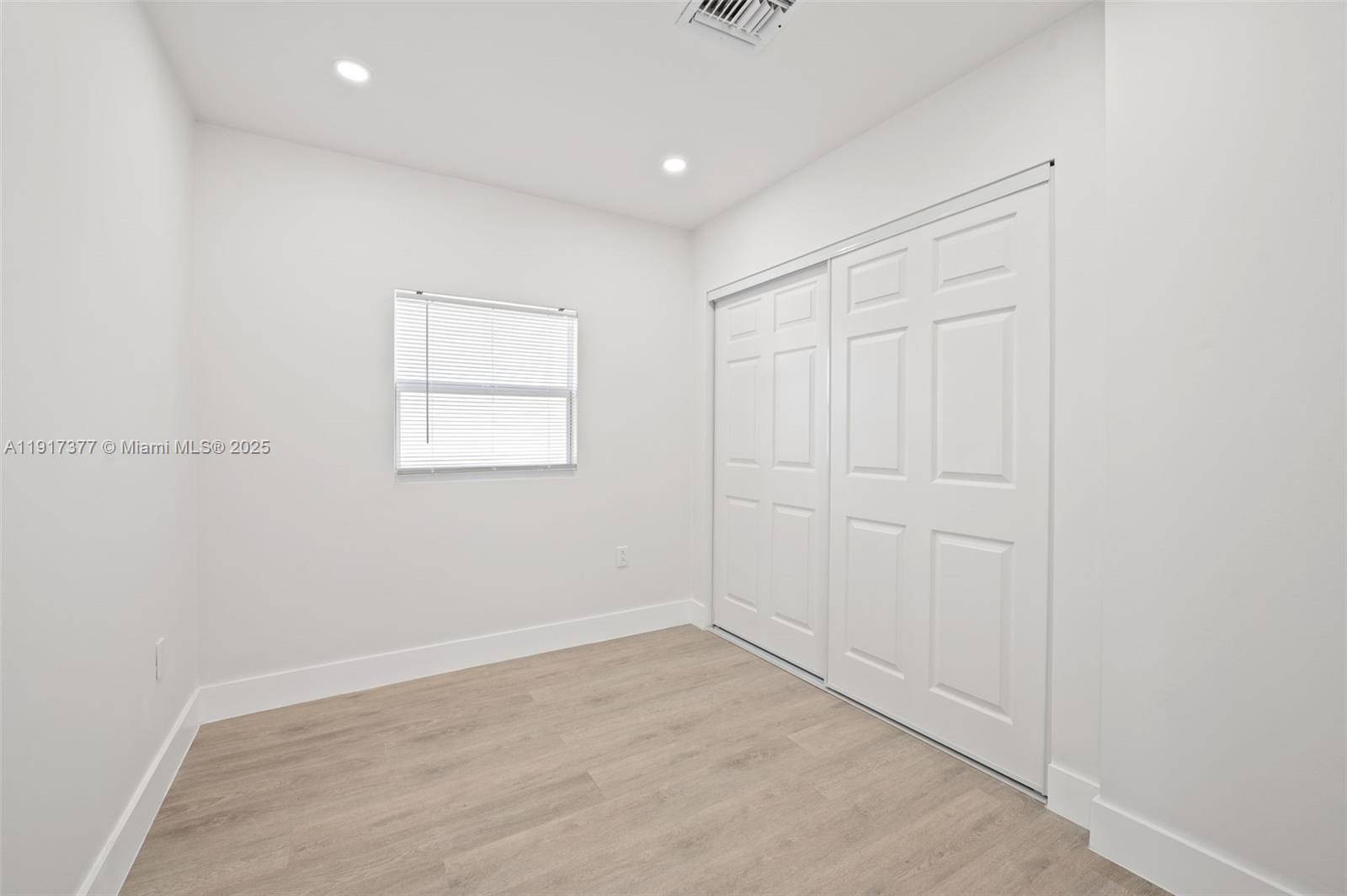 1844 Northwest 67th Street Miami, FL 33147 - Photo 15 of 27 an empty room with windows and closet