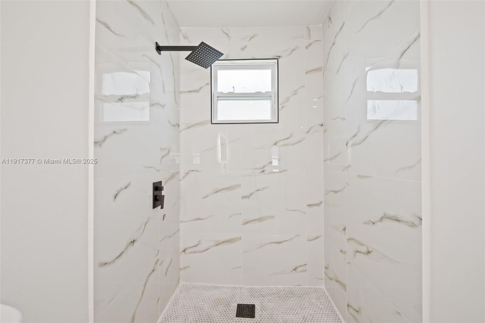 1844 Northwest 67th Street Miami, FL 33147 - Photo 19 of 27 a bathroom with a shower