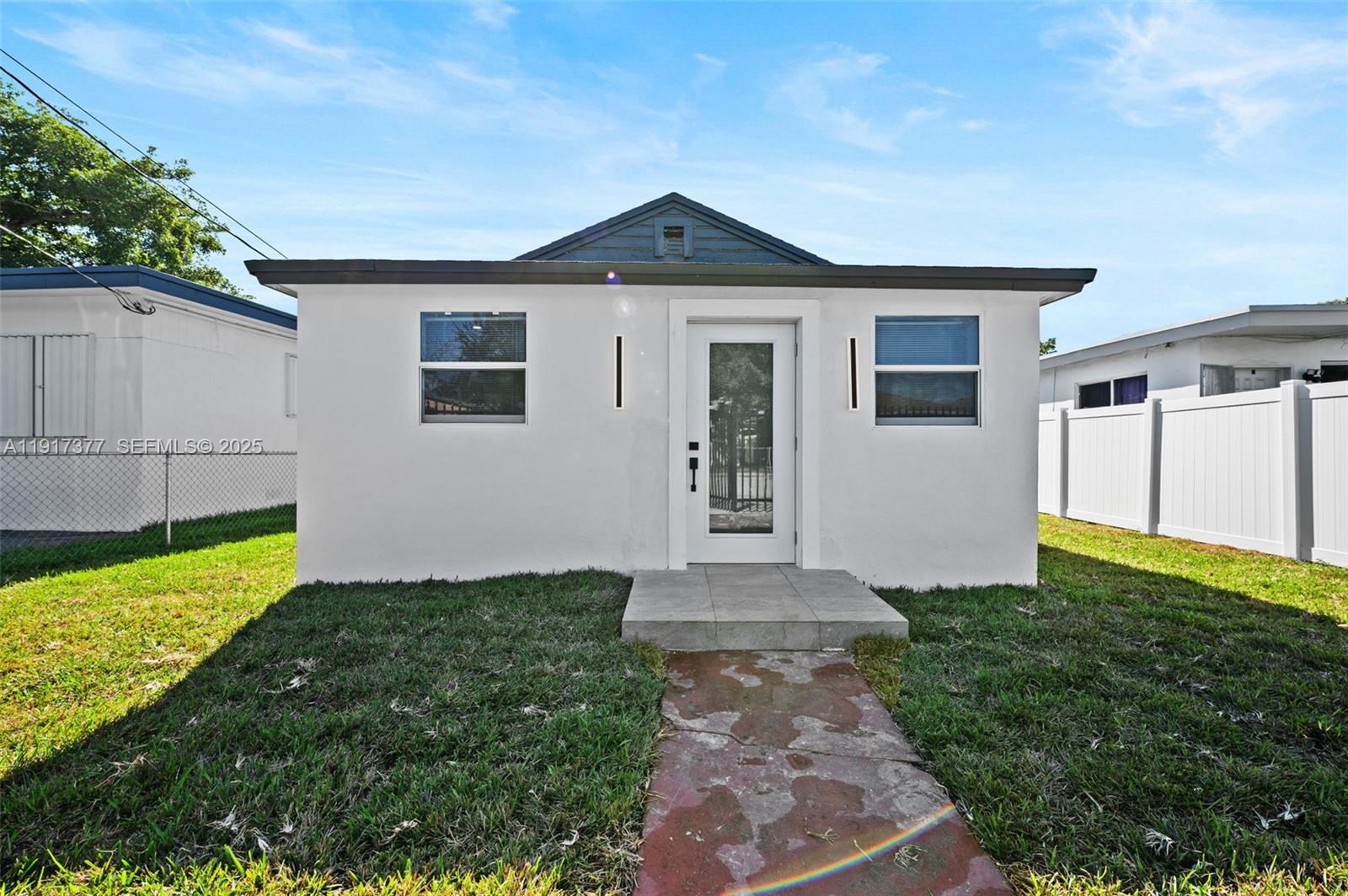1844 Northwest 67th Street Miami, FL 33147 - Photo 5 of 27 a front view of a house with a yard