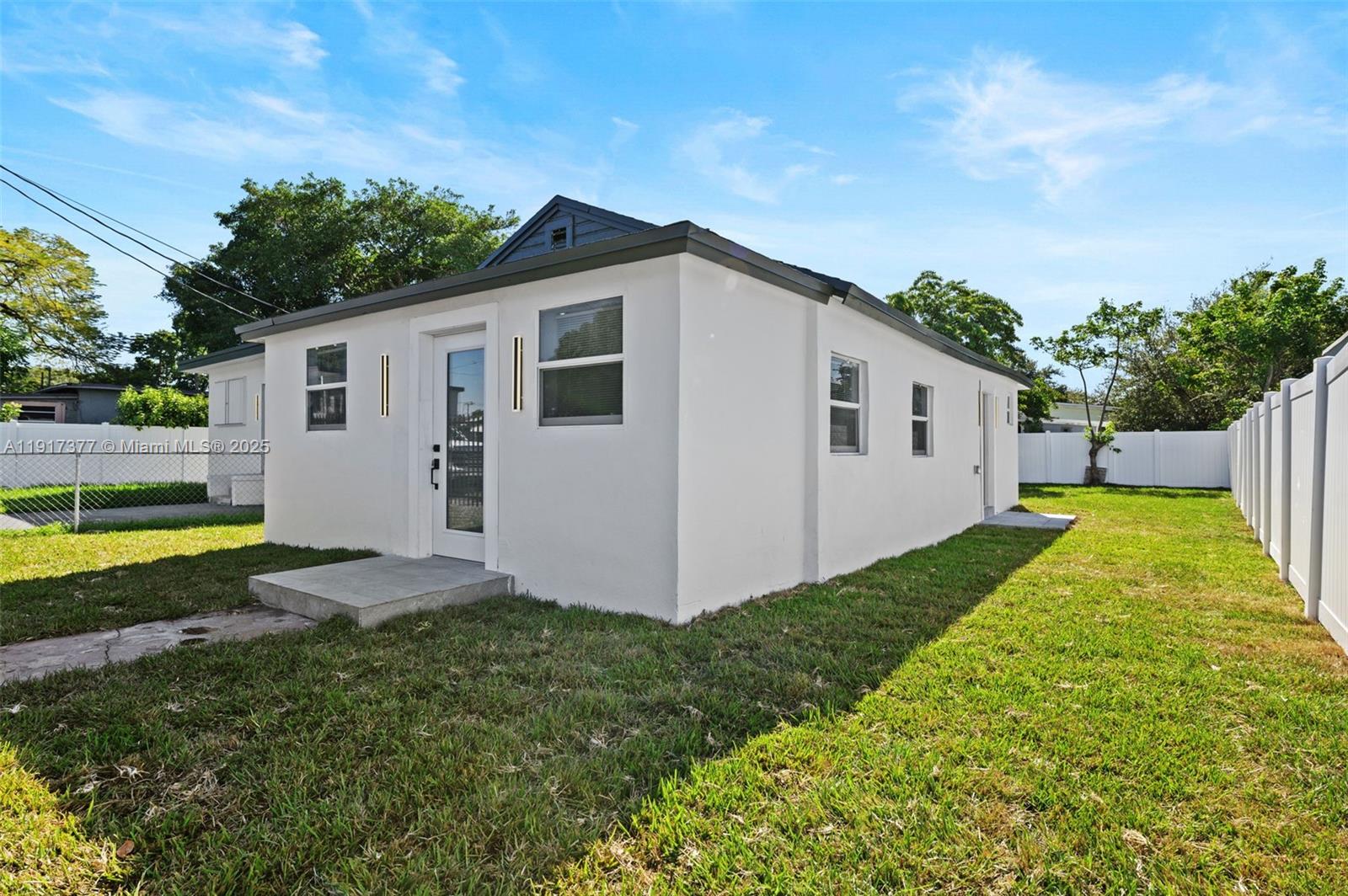 1844 Northwest 67th Street Miami, FL 33147 - Photo 6 of 27 a view of backyard with a garden and plants