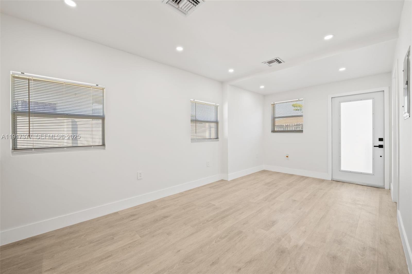 1844 Northwest 67th Street Miami, FL 33147 - Photo 9 of 27 a view of an empty room with a window