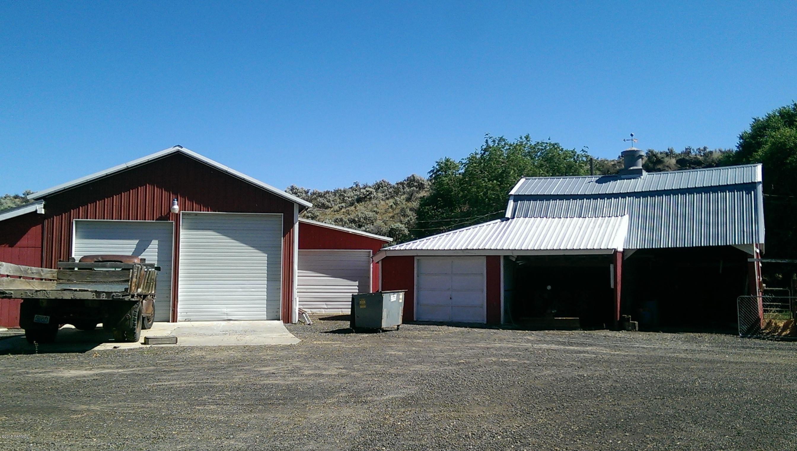 120 Funkhouser Road Tieton, WA 98947 - Photo 2 of 19 a front view of a house with a yard