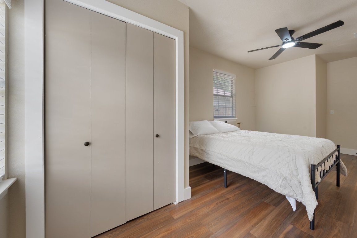 206 Jan Lane Georgetown, TX 78626 - Photo 13 of 23 a bedroom with a bed and a chandelier