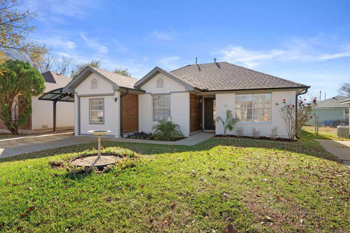 206 Jan Lane Georgetown, TX 78626 - Photo 2 of 23 a front view of a house with garden