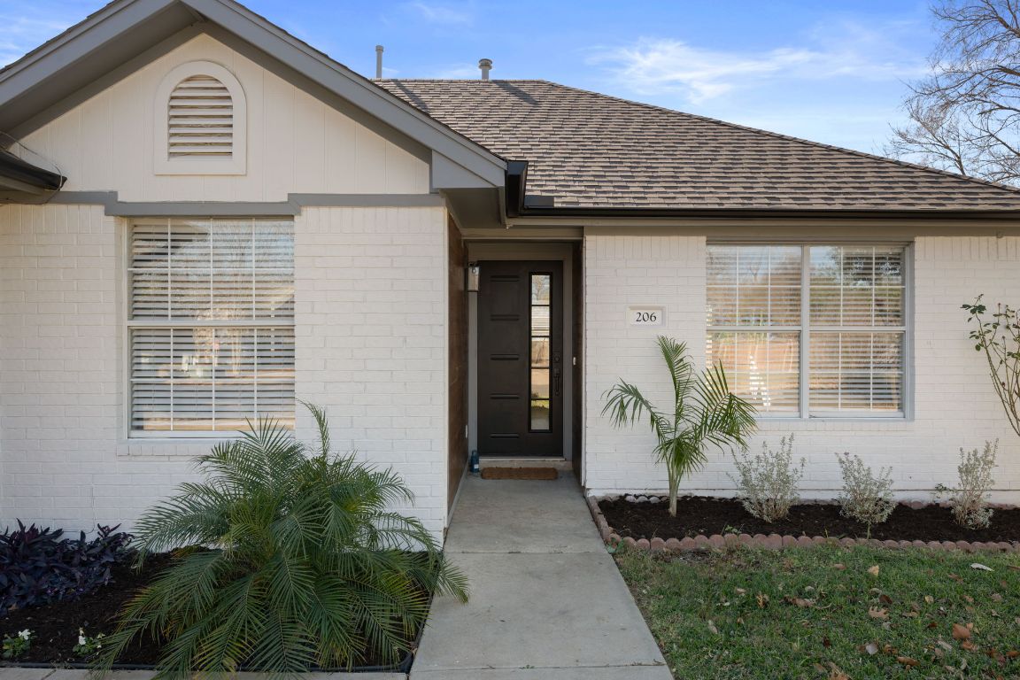 206 Jan Lane Georgetown, TX 78626 - Photo 23 of 23 a front view of a house with a garden