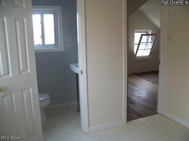 249 Center Road Bedford, OH 44146 - Photo 16 of 25 Foyer on third floor showing half bath