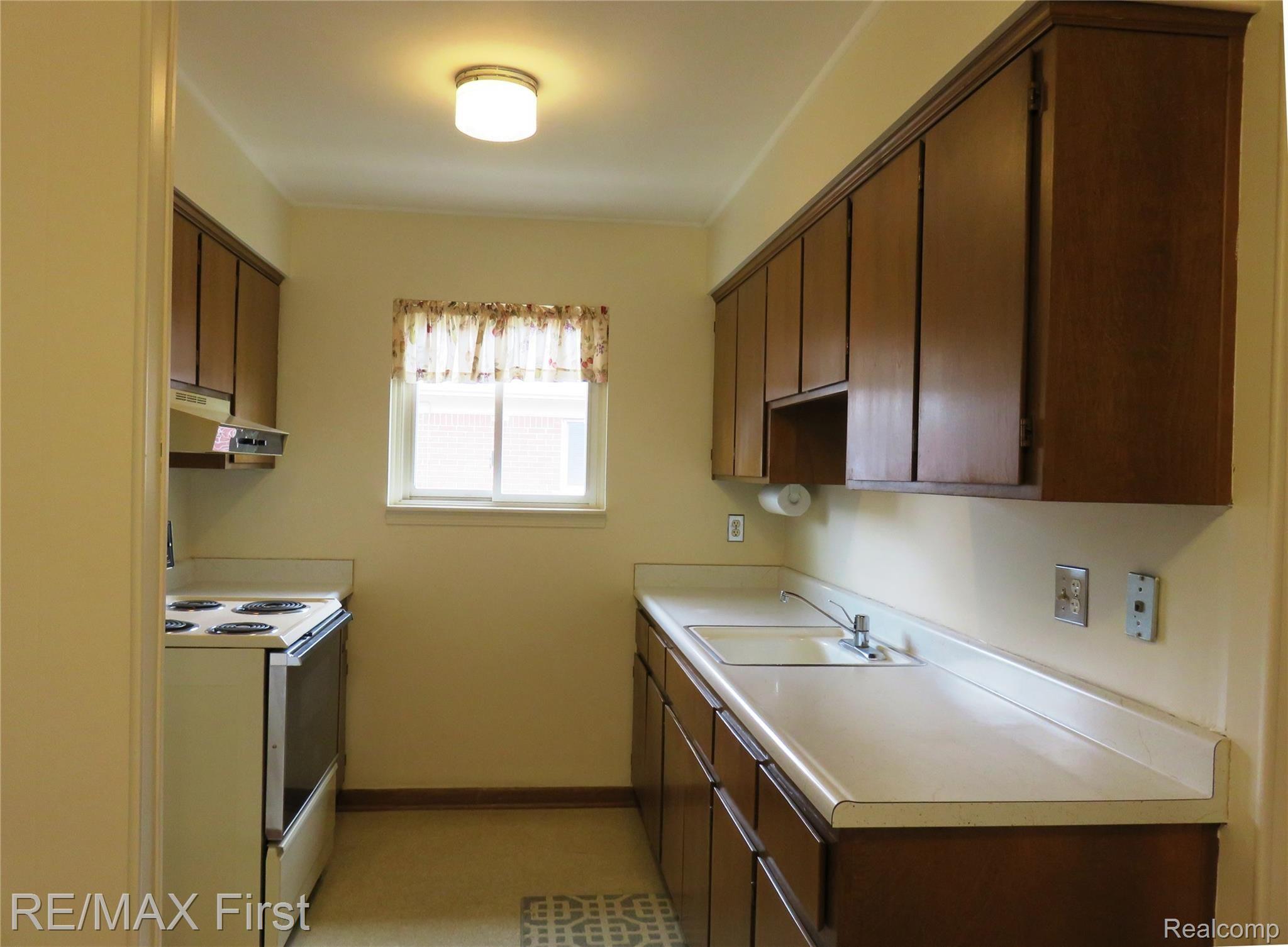 15219 East 9 Mile Road, Unit 7 Eastpointe, MI 48021 - Photo 7 of 13 15219 9 mile kitchen 2.JPG