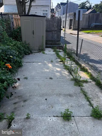 a view of a backyard with sitting area