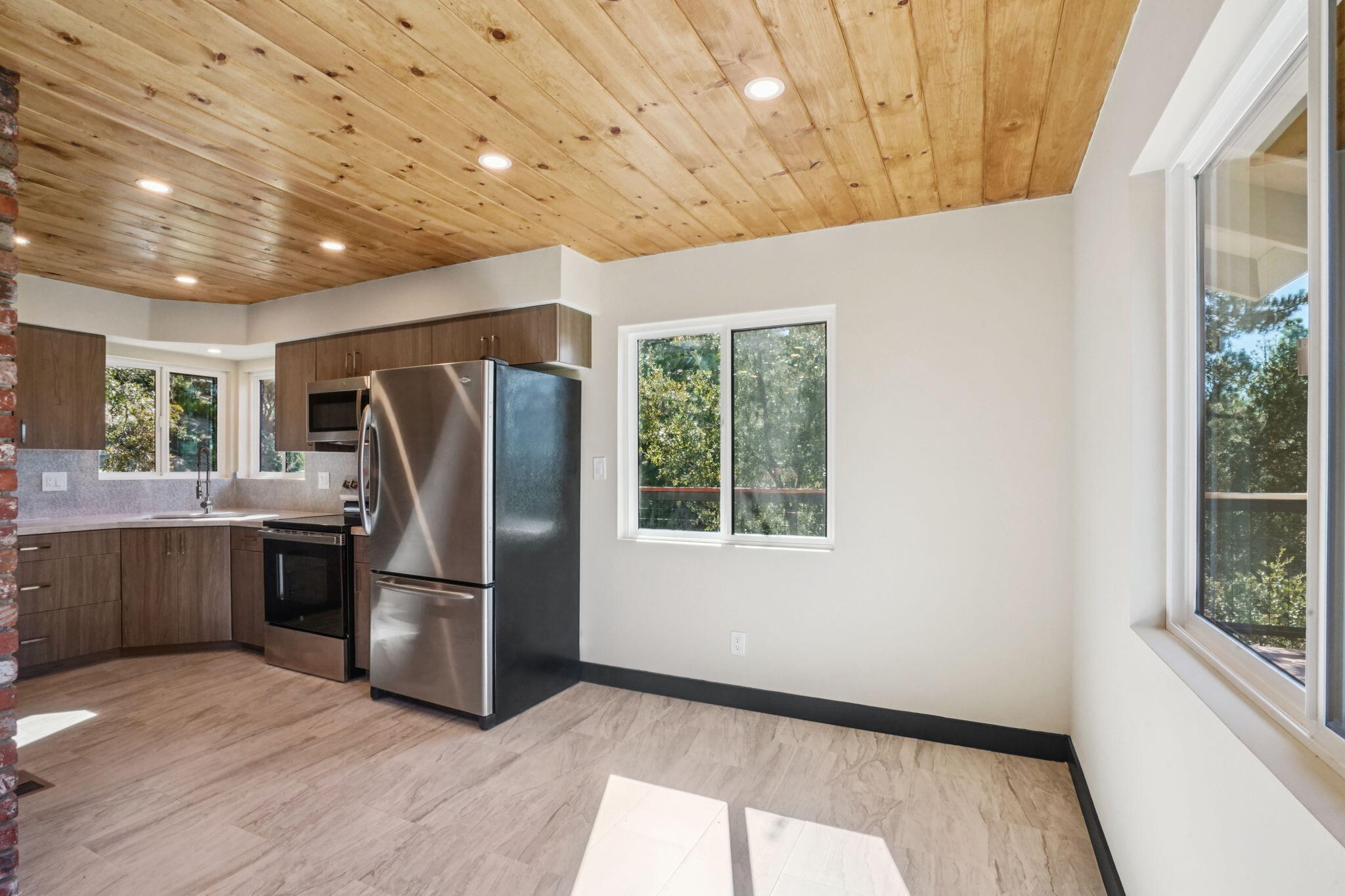54091 North Ridge Drive Idyllwild, CA 92549 - Photo 12 of 58 a kitchen with stainless steel appliances a refrigerator and wooden floor