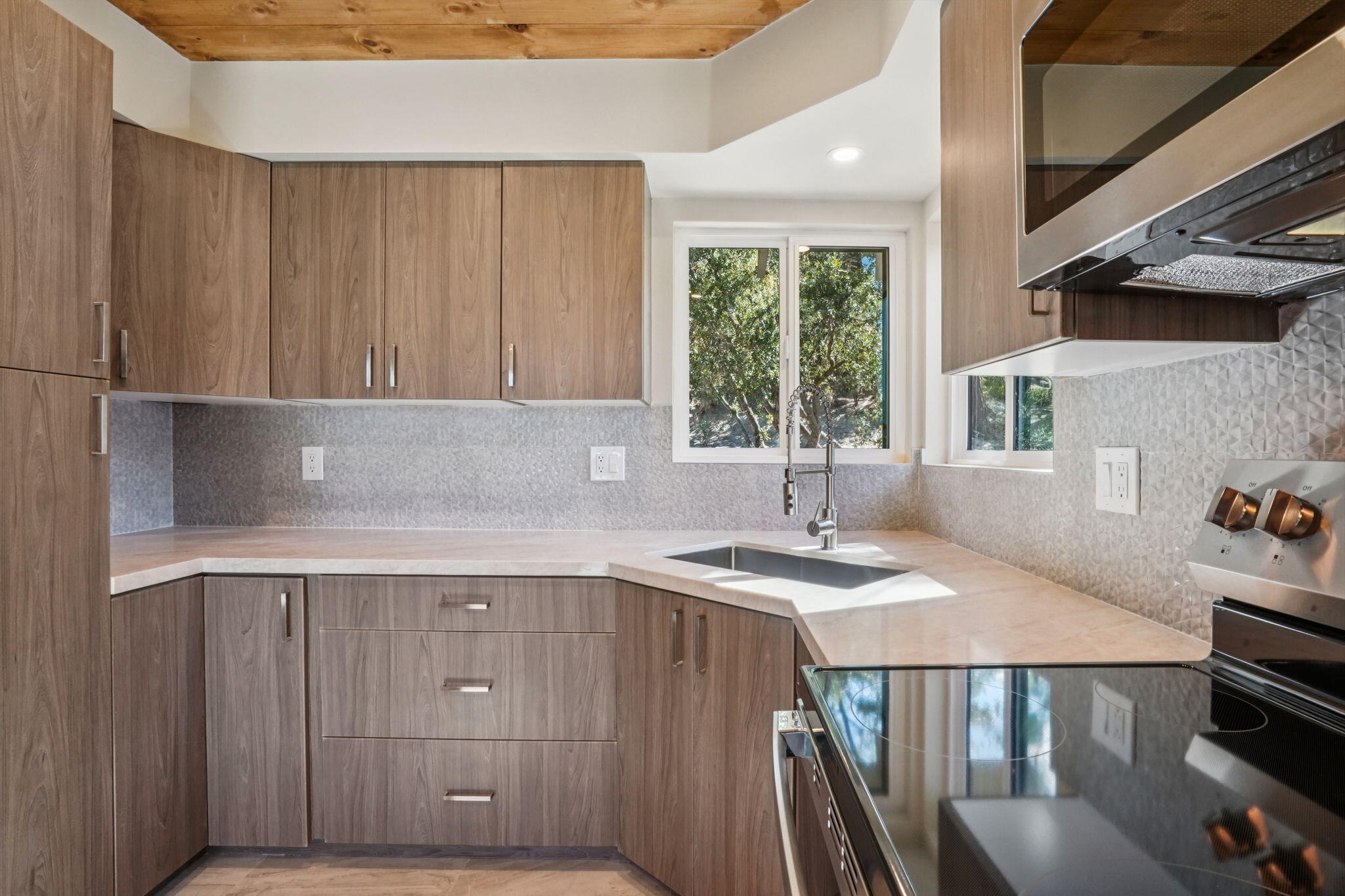54091 North Ridge Drive Idyllwild, CA 92549 - Photo 15 of 58 a kitchen with a stove a sink and a cabinets