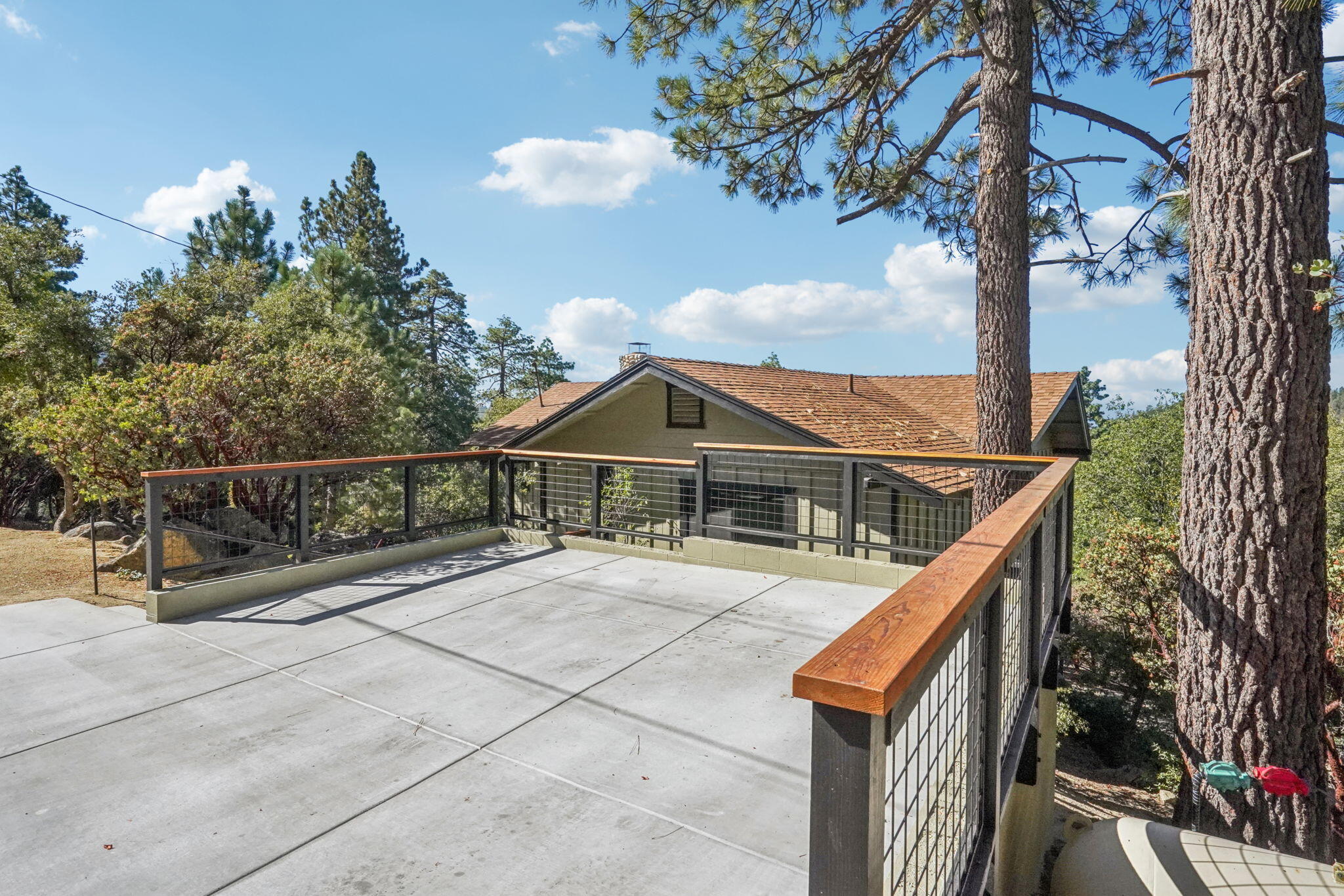 54091 North Ridge Drive Idyllwild, CA 92549 - Photo 3 of 58 a view of a house with wooden fence