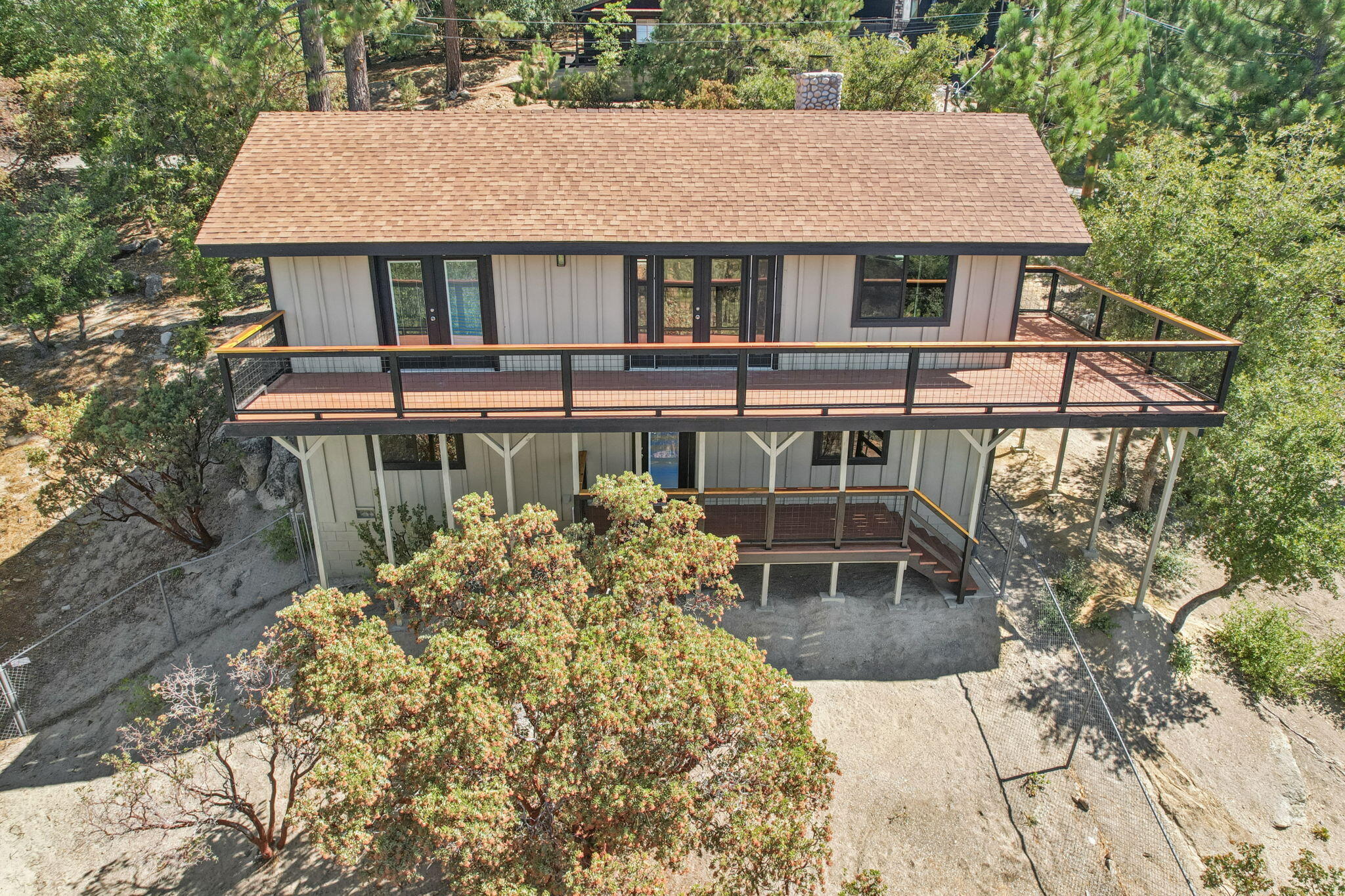 54091 North Ridge Drive Idyllwild, CA 92549 - Photo 39 of 58 a house with tall trees in the background
