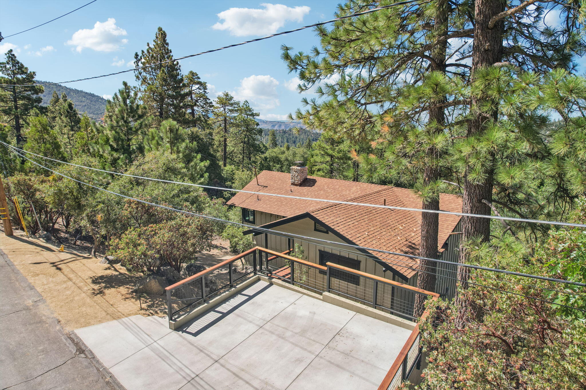 54091 North Ridge Drive Idyllwild, CA 92549 - Photo 45 of 58 a view of a roof deck with wooden fence and plants