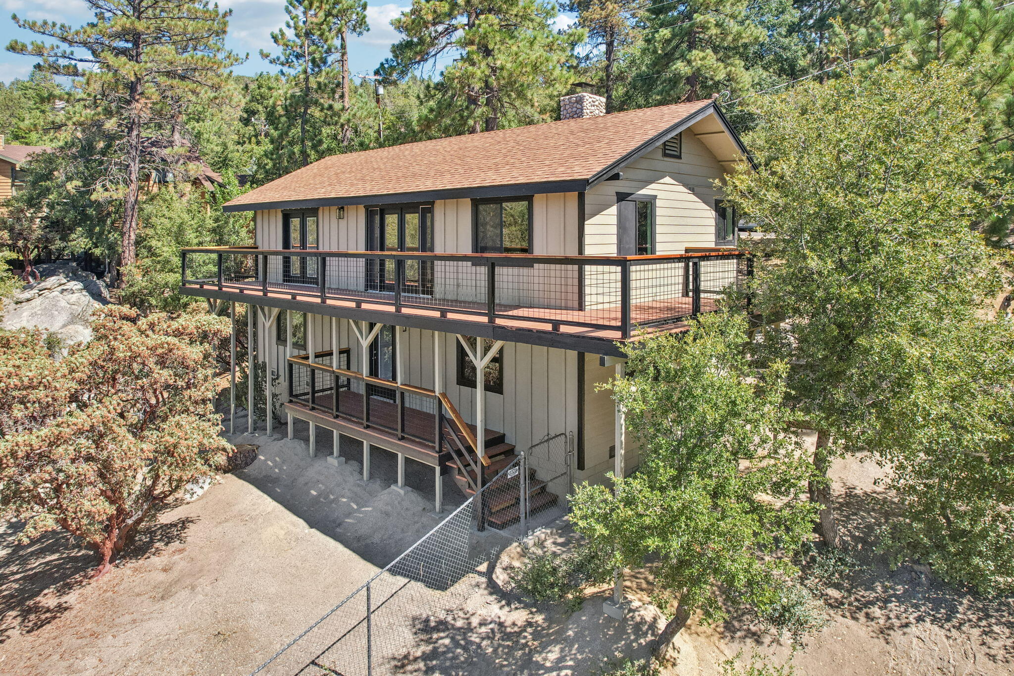54091 North Ridge Drive Idyllwild, CA 92549 - Photo 53 of 58 a view of a house with patio and a garden