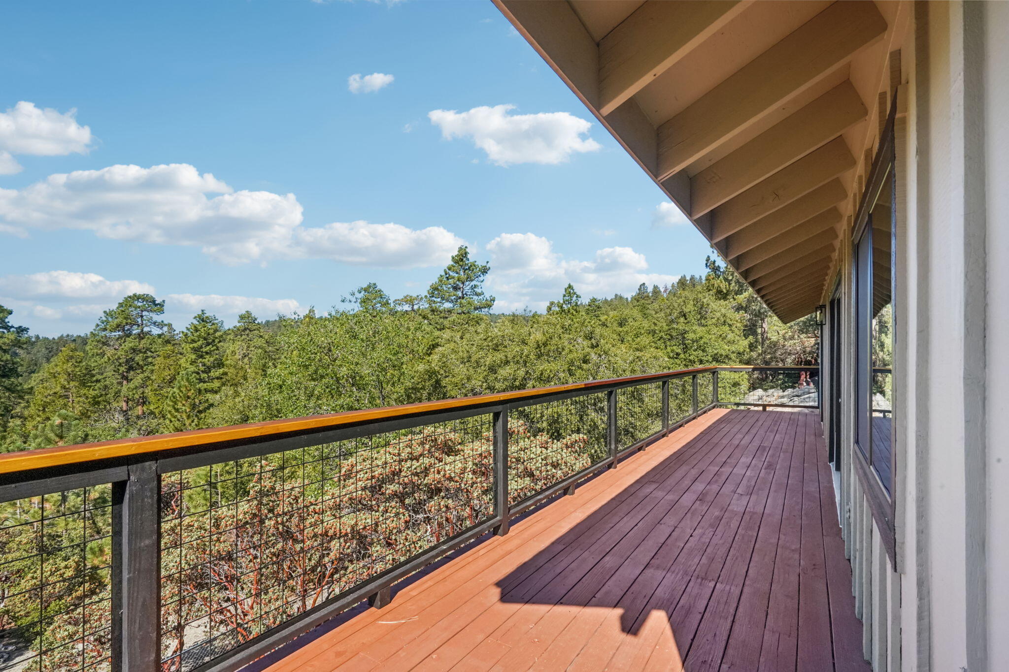 54091 North Ridge Drive Idyllwild, CA 92549 - Photo 10 of 58 a view of a balcony with wooden floor