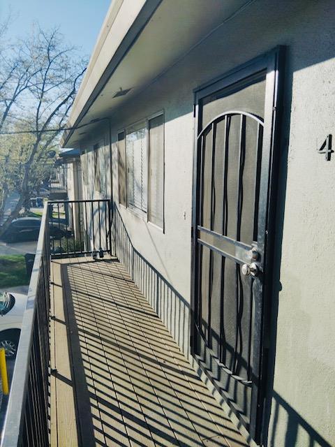 5960 Walerga Road, Unit 4 Sacramento, CA 95842 - Photo 2 of 9 a view of staircase with lots of frames on wall and a large window