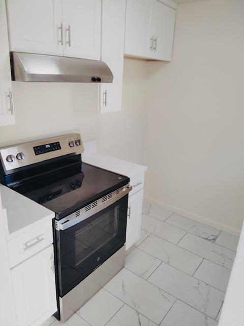 5960 Walerga Road, Unit 4 Sacramento, CA 95842 - Photo 5 of 9 a stove top oven sitting inside of a kitchen