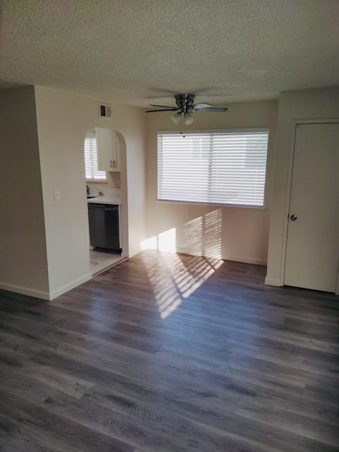 5960 Walerga Road, Unit 4 Sacramento, CA 95842 - Photo 7 of 9 a view of empty room with wooden floor and window